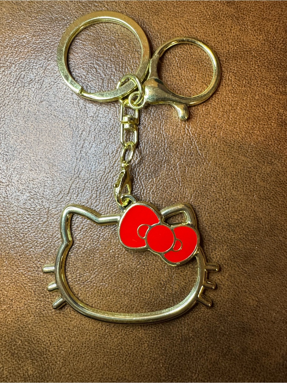 NWT Hello Kitty Gold Tone Bag Charm with Red Bow